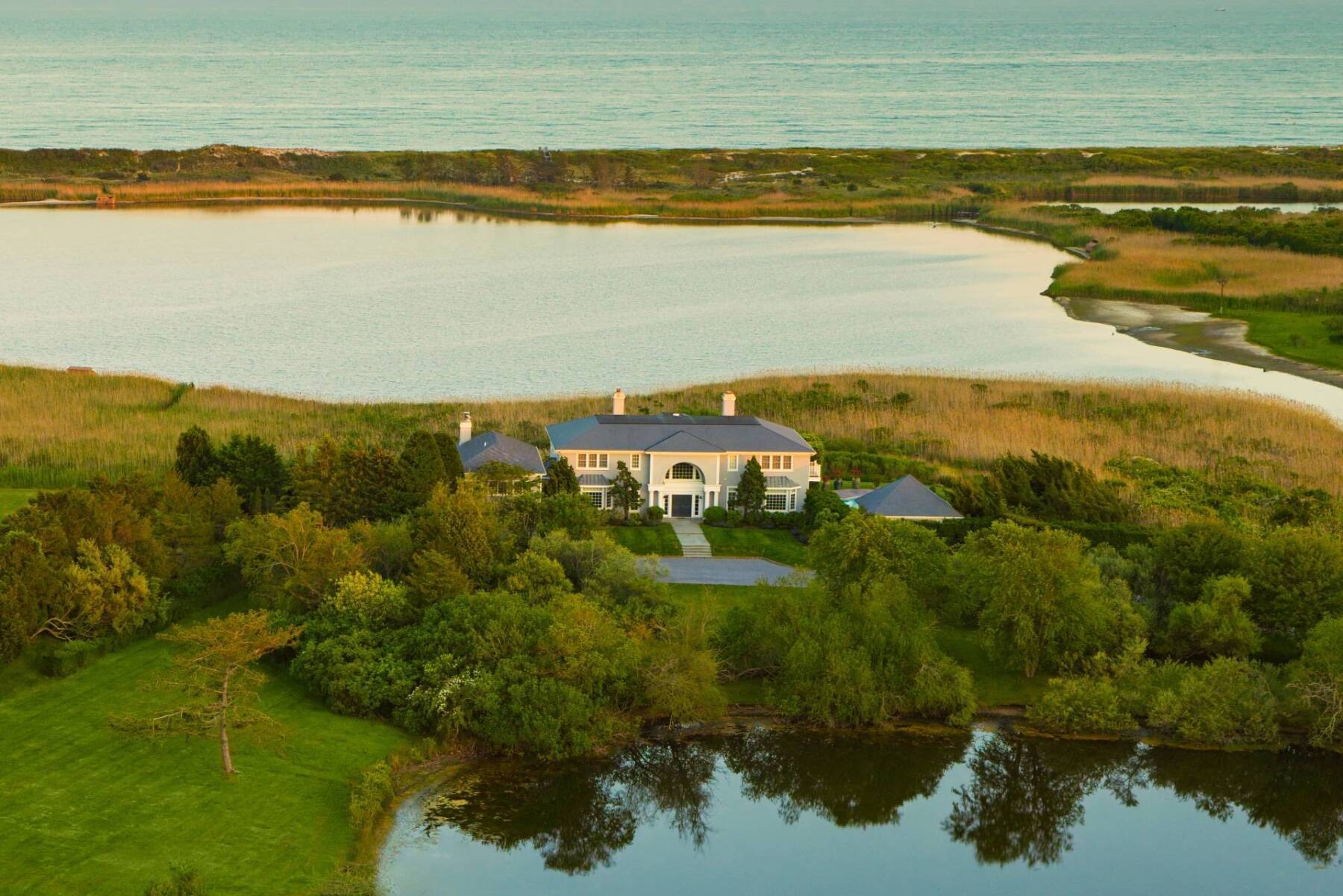 large estate surrounded on two sides by bodies of water