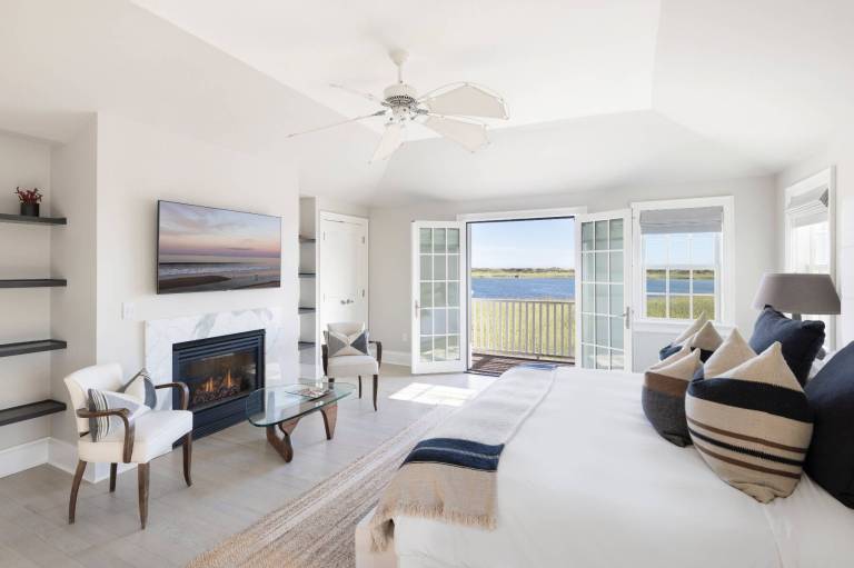 white bedroom with water views