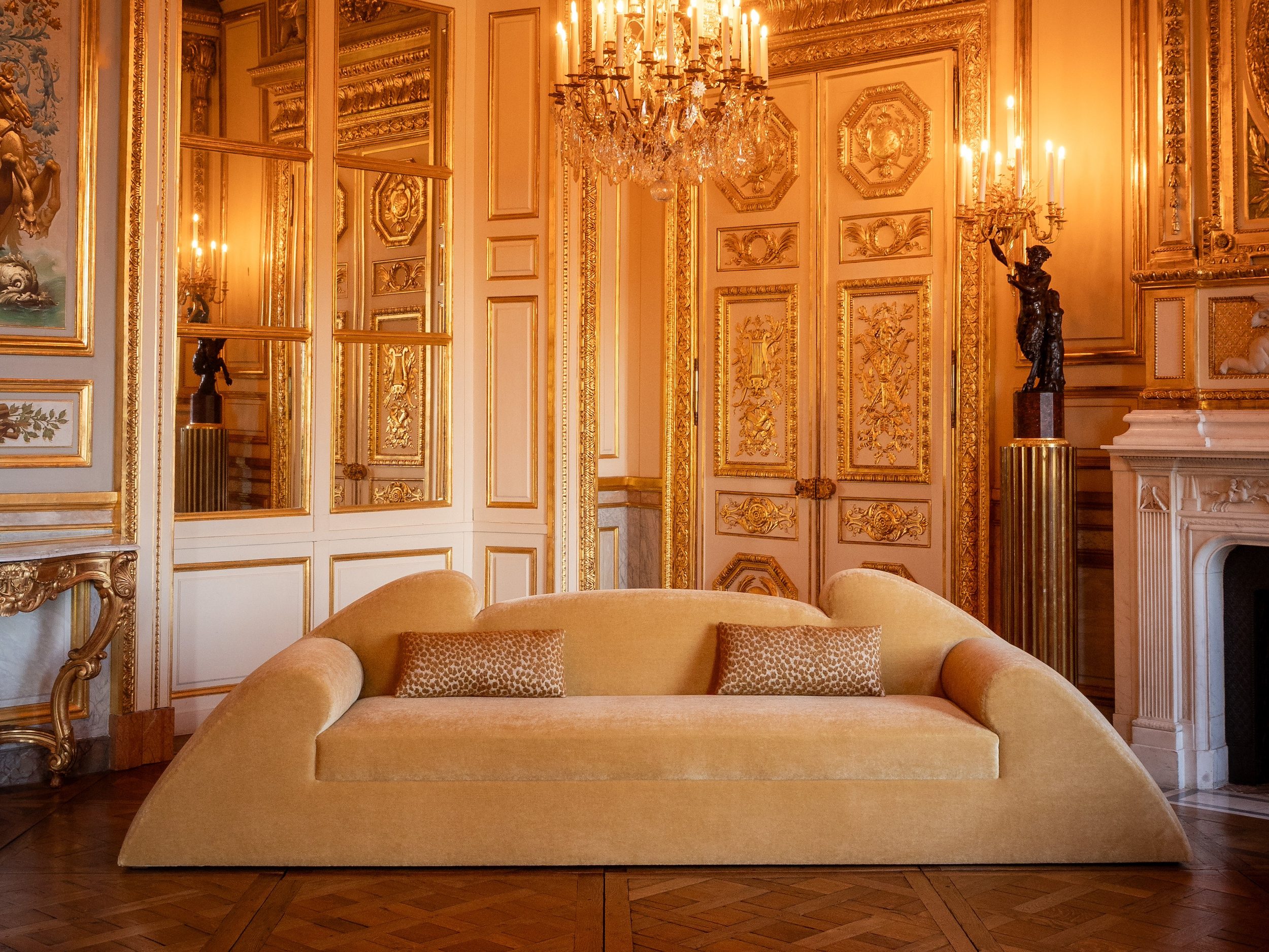 unique gold low sofa in ornate room