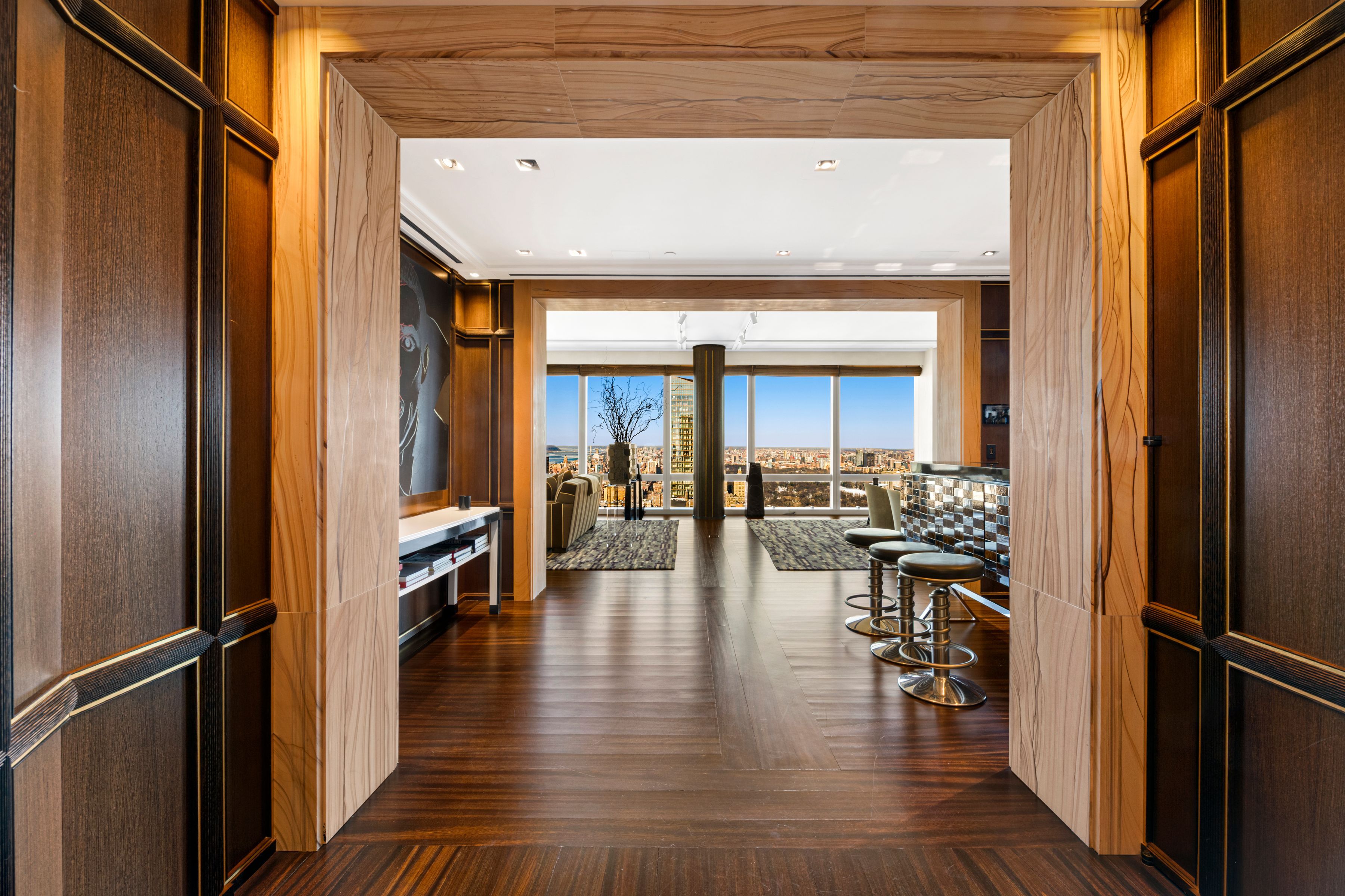 entryway to New York City flat  with wood   paneling