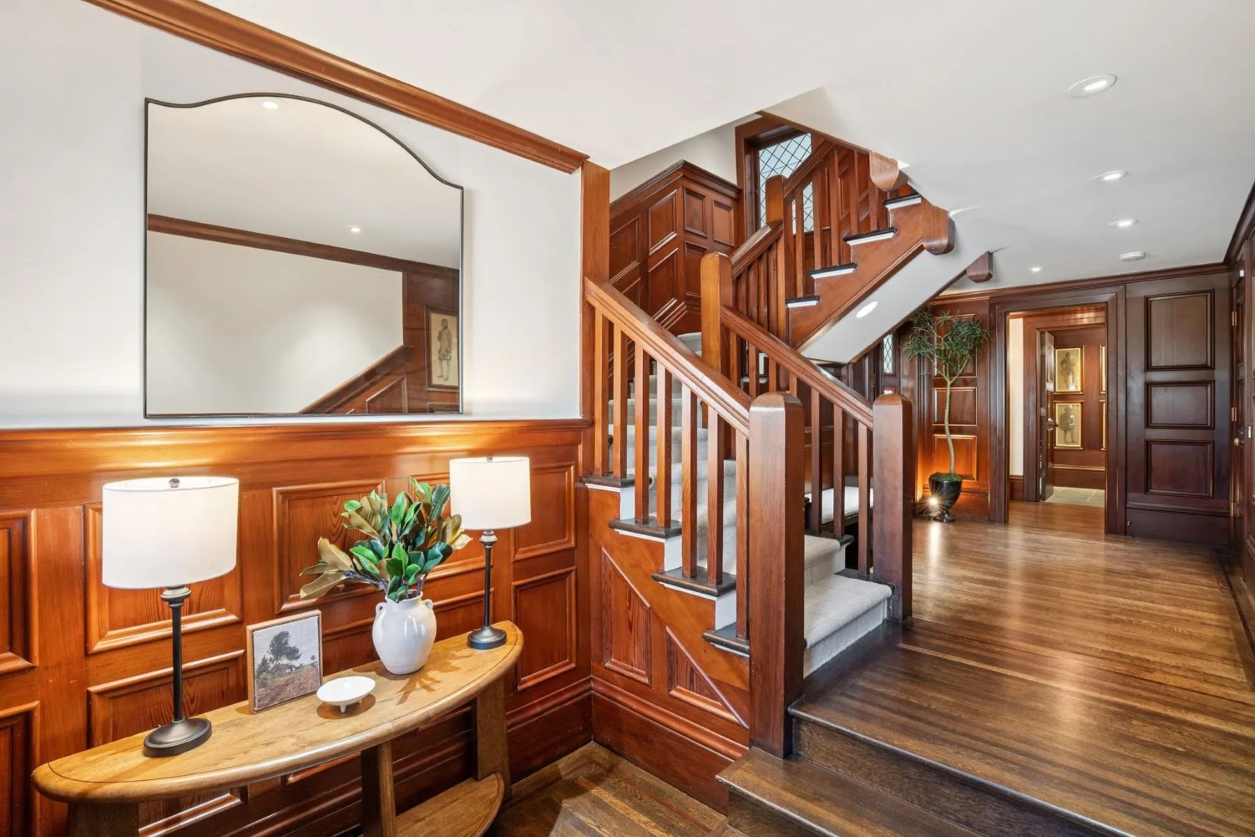 entryway with wood detailing and staircase