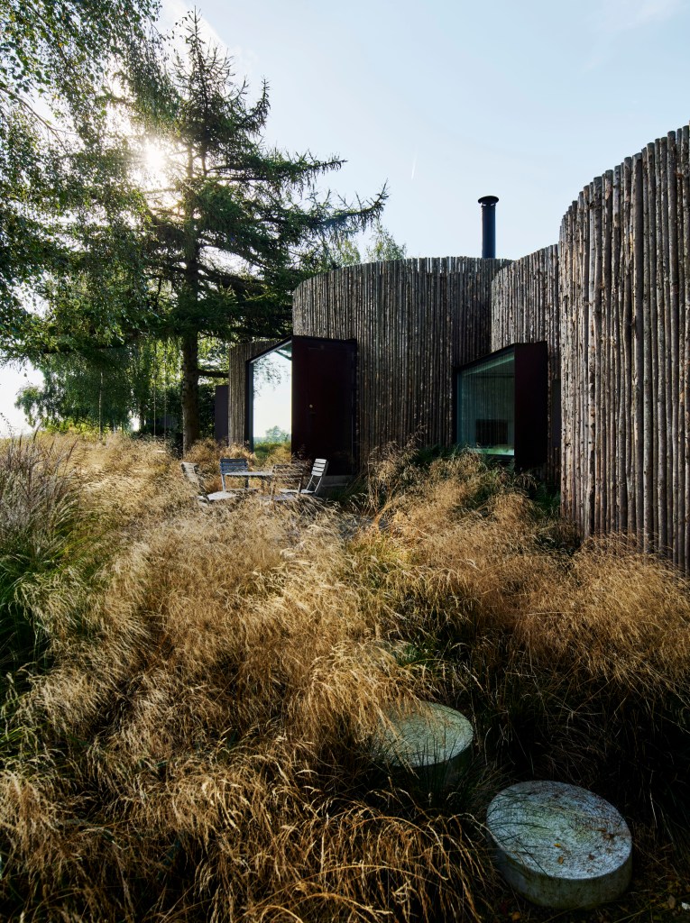 cylindrical Nordic home surrounded by plants