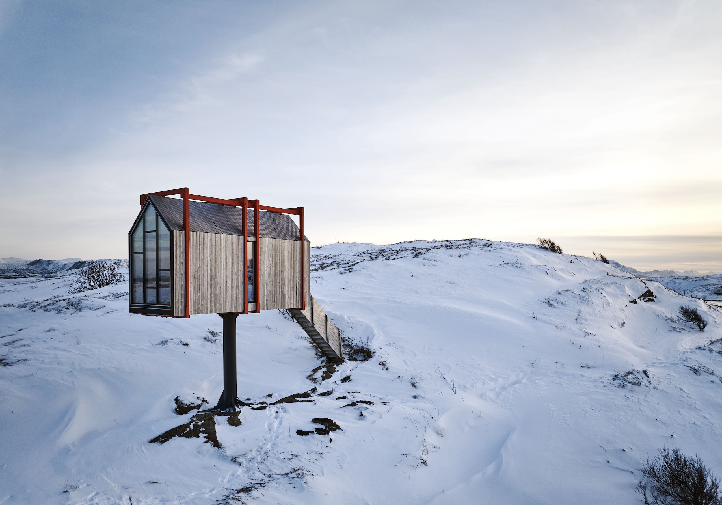 Nordic house set above snowy hills