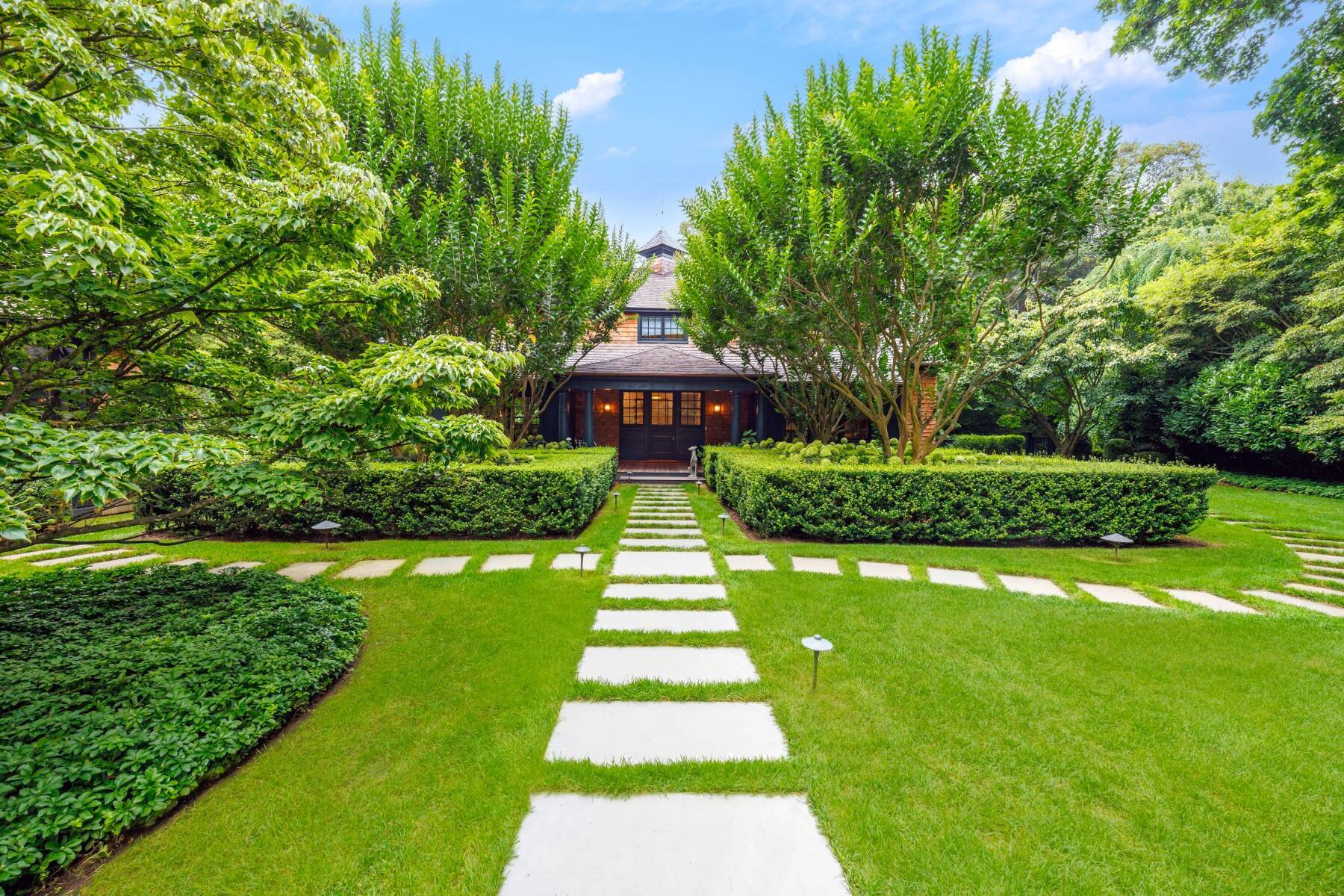 exterior of East Hampton home with lush greenery 