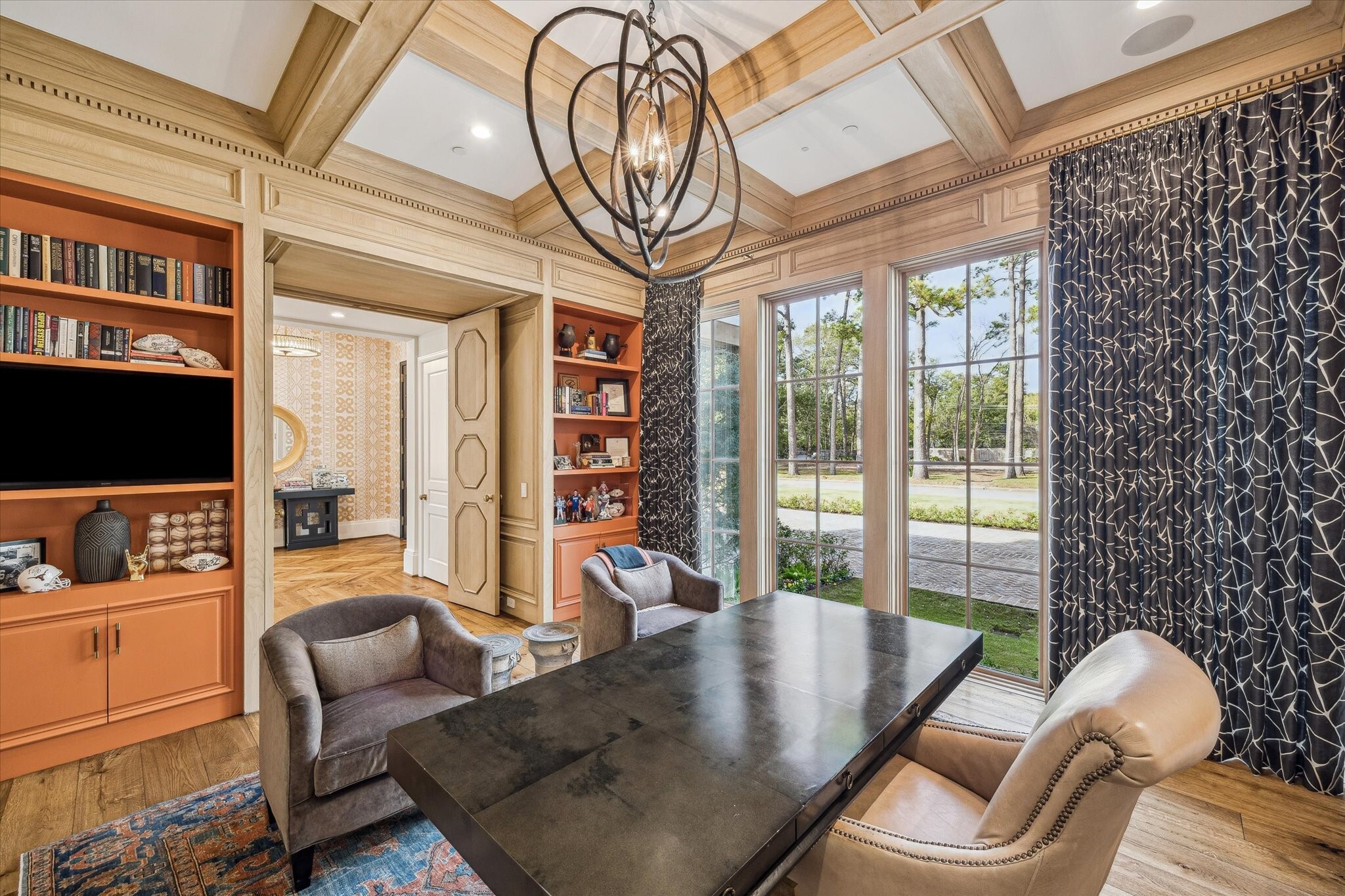home office with oak floors and ceiling details with large windows
