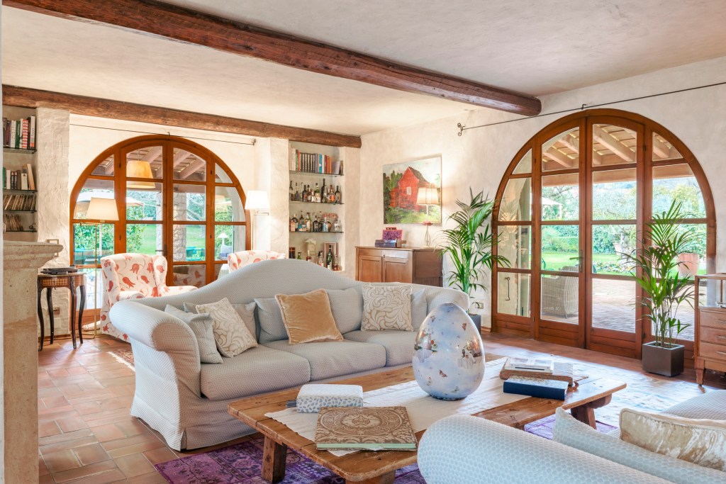sitting area with large arched windows in Verona home 