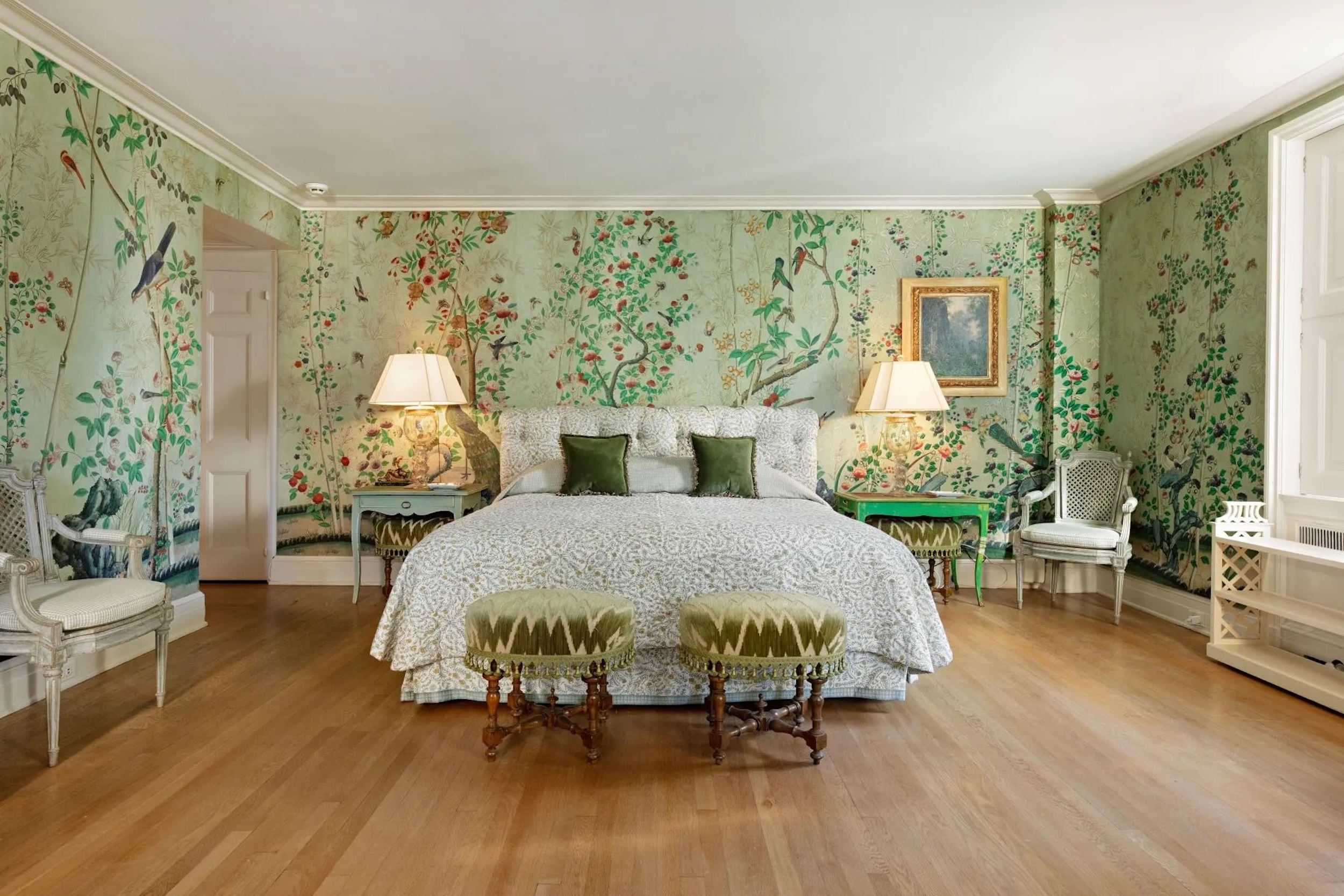 New York bedroom with green botanical wallpaper and green accent furniture