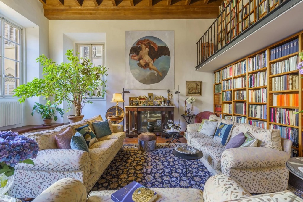 interior of Florence apartment with sitting area and bookshelves 