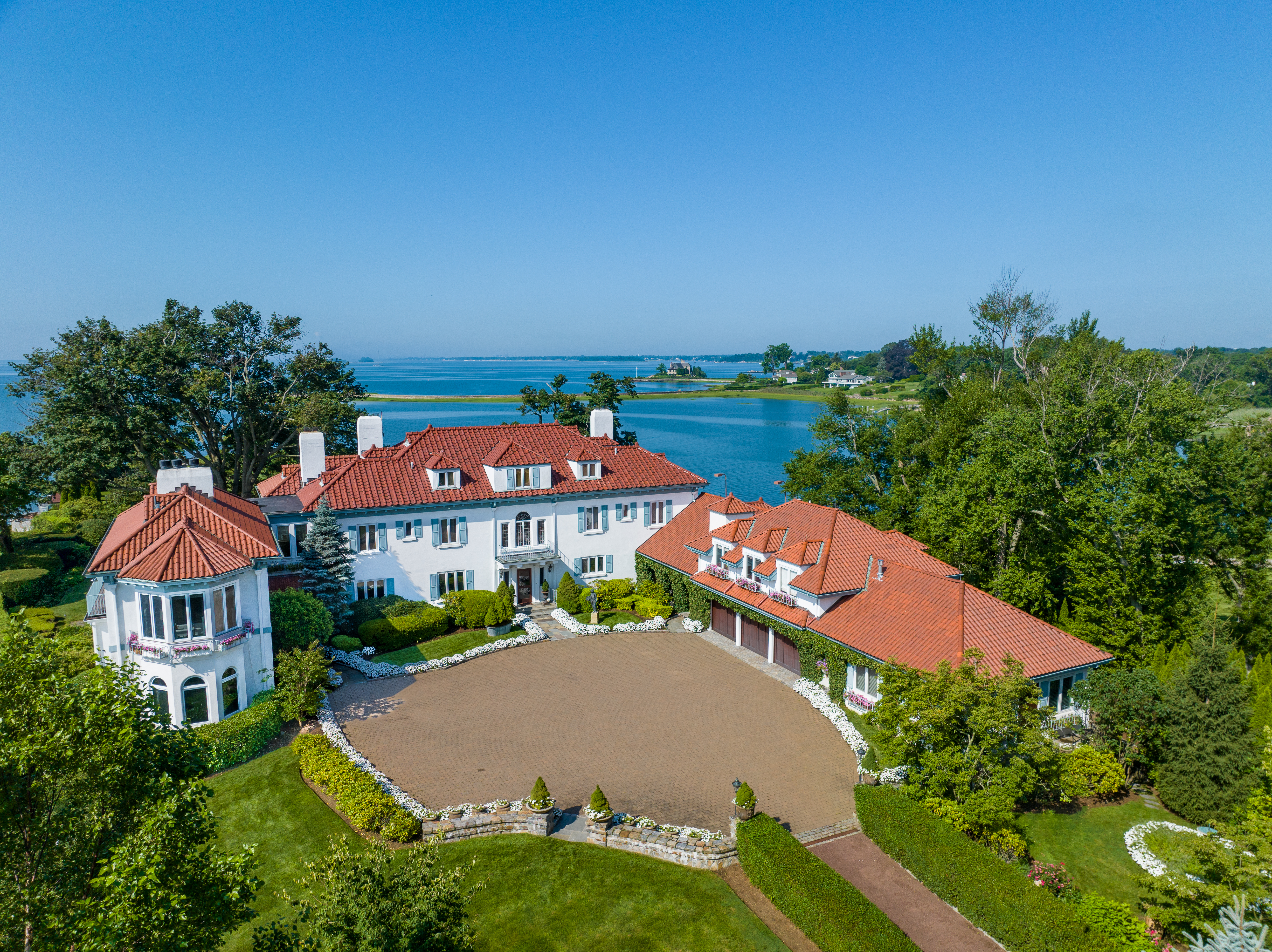 Aerial exterior of villa with red tile roof at the Cedar Cliff estate in Connecticut