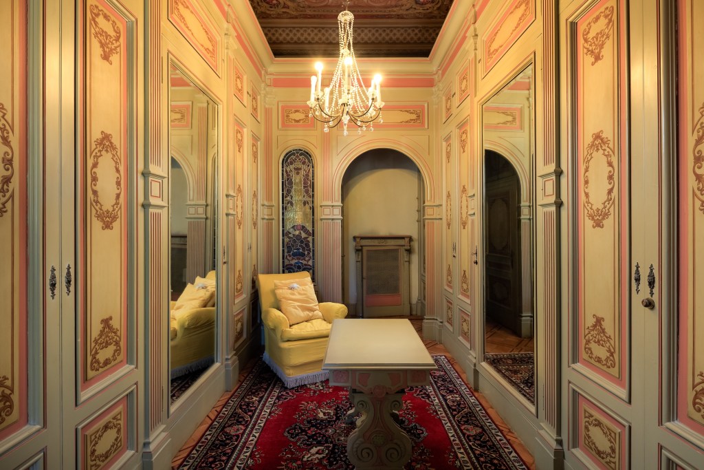 Ornate dressing room with chandelier in Italy