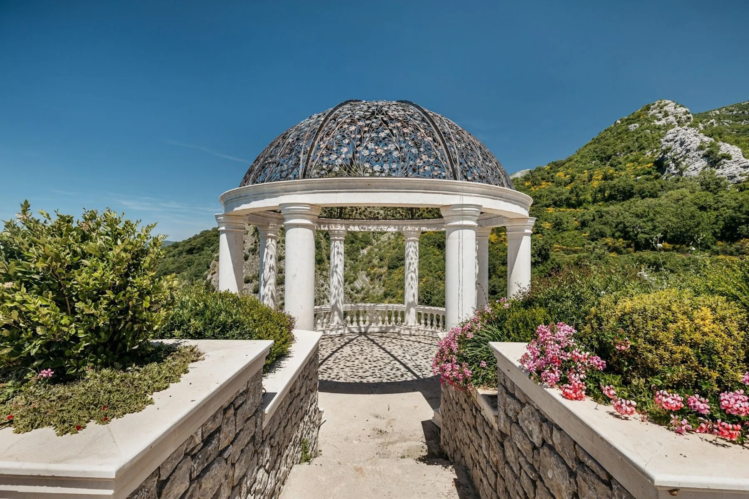 ornate pergola surrounded by flowers in Montenegro