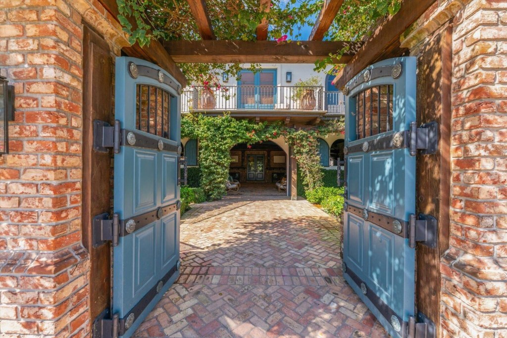 Gates opening to an equestrian property in Wellington, Florida