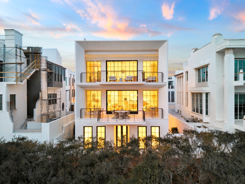 Back view of a three-story home in Alys Beach, Florida