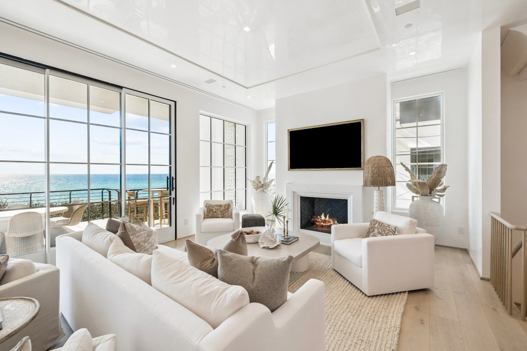 Living room with floor-to-ceiling windows and an ocean view in Alys Beach, Florida