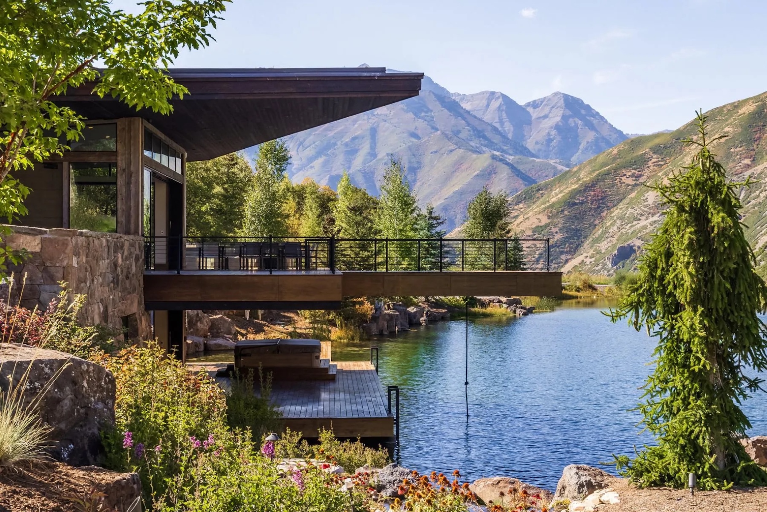 terraces over water in Utah home with mountain backdrop
