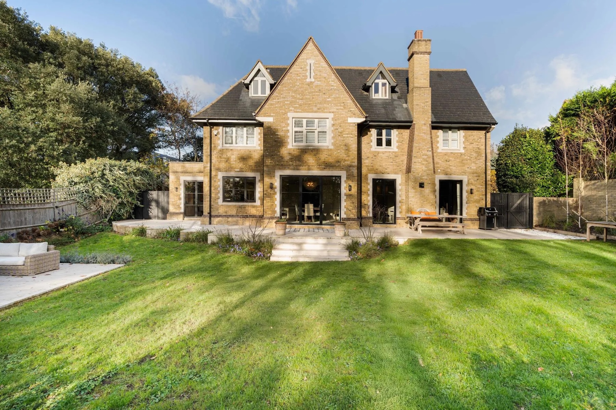 exterior of brick home in Wimbledon with grassy back yard 
