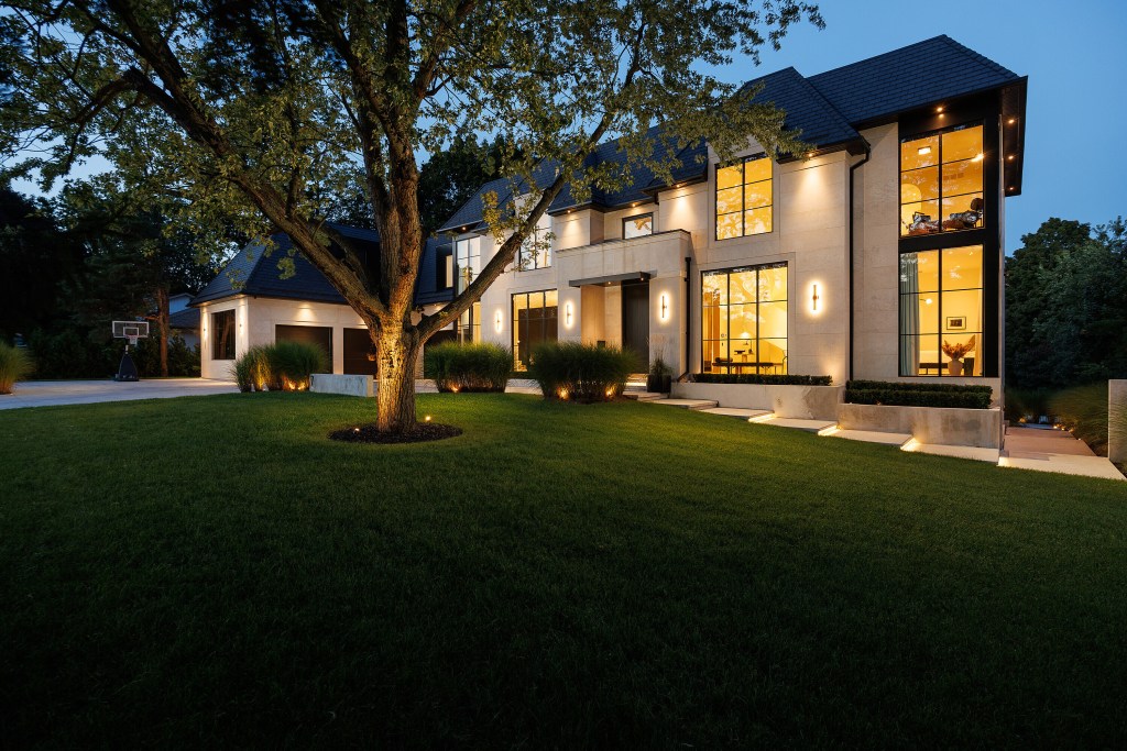 exterior of well-lit custom home in Toronto