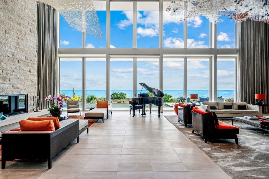 interior living space in Vero Beach home with water views from expansive glass