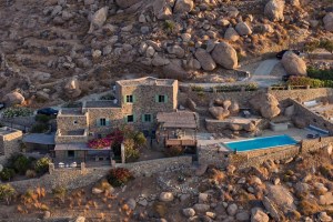aerial view of stone villa in Mykonos, Greece with pool