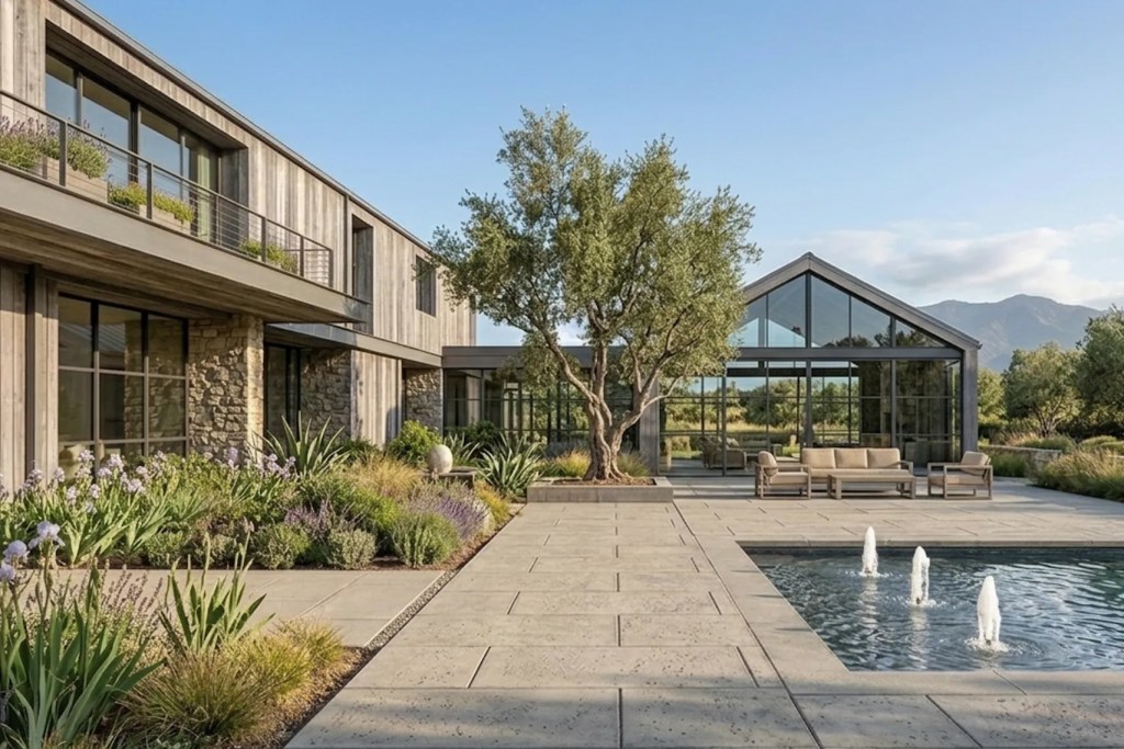 The back of a contemporary home in Petaluma, California with a landscaping and a pool with fountains.