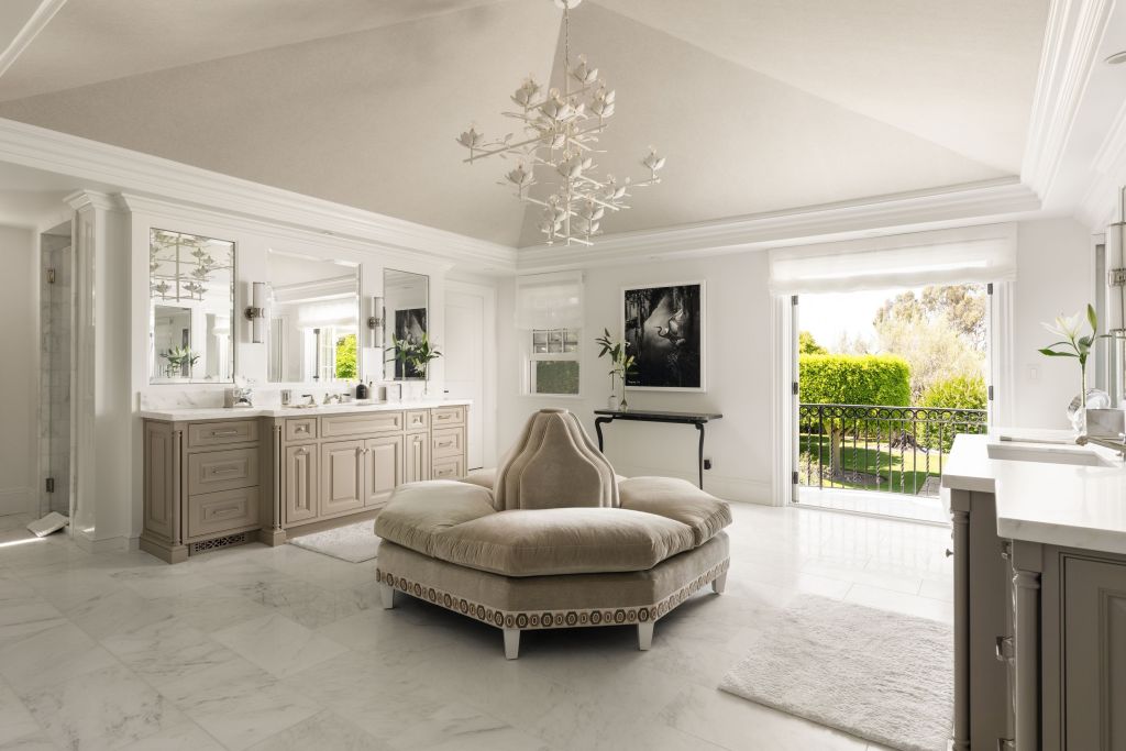 dual vanity bathroom with French doors leading to balcony