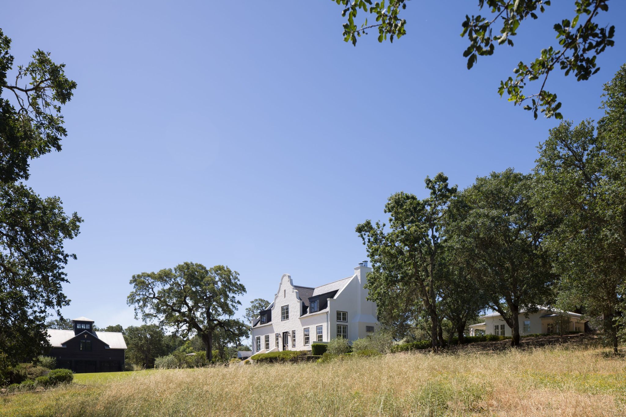 exterior shot of Glen Ellen, California wine country estate with Cape Dutch-style home