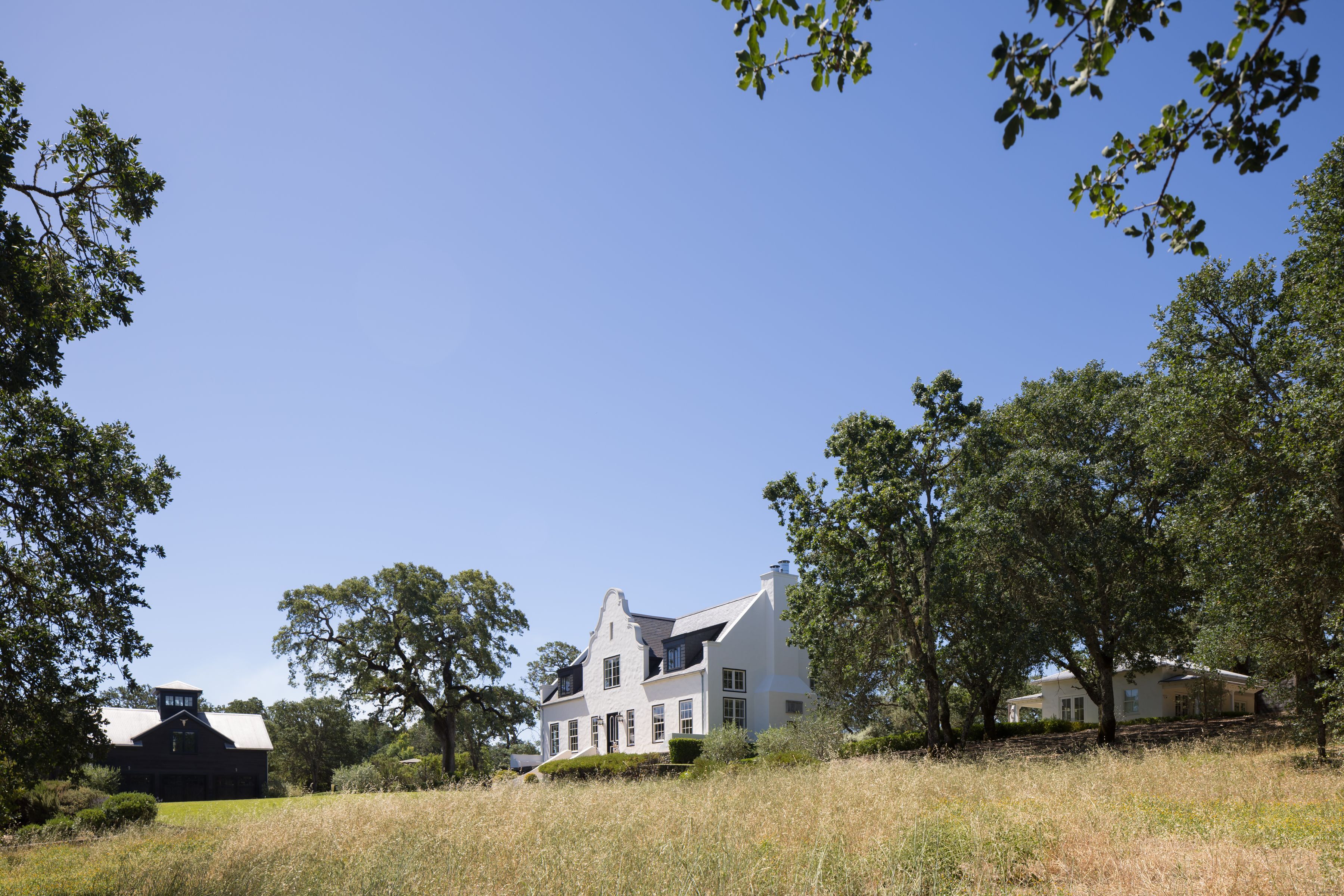 exterior shot of Glen Ellen, California wine country estate with Cape Dutch-style home