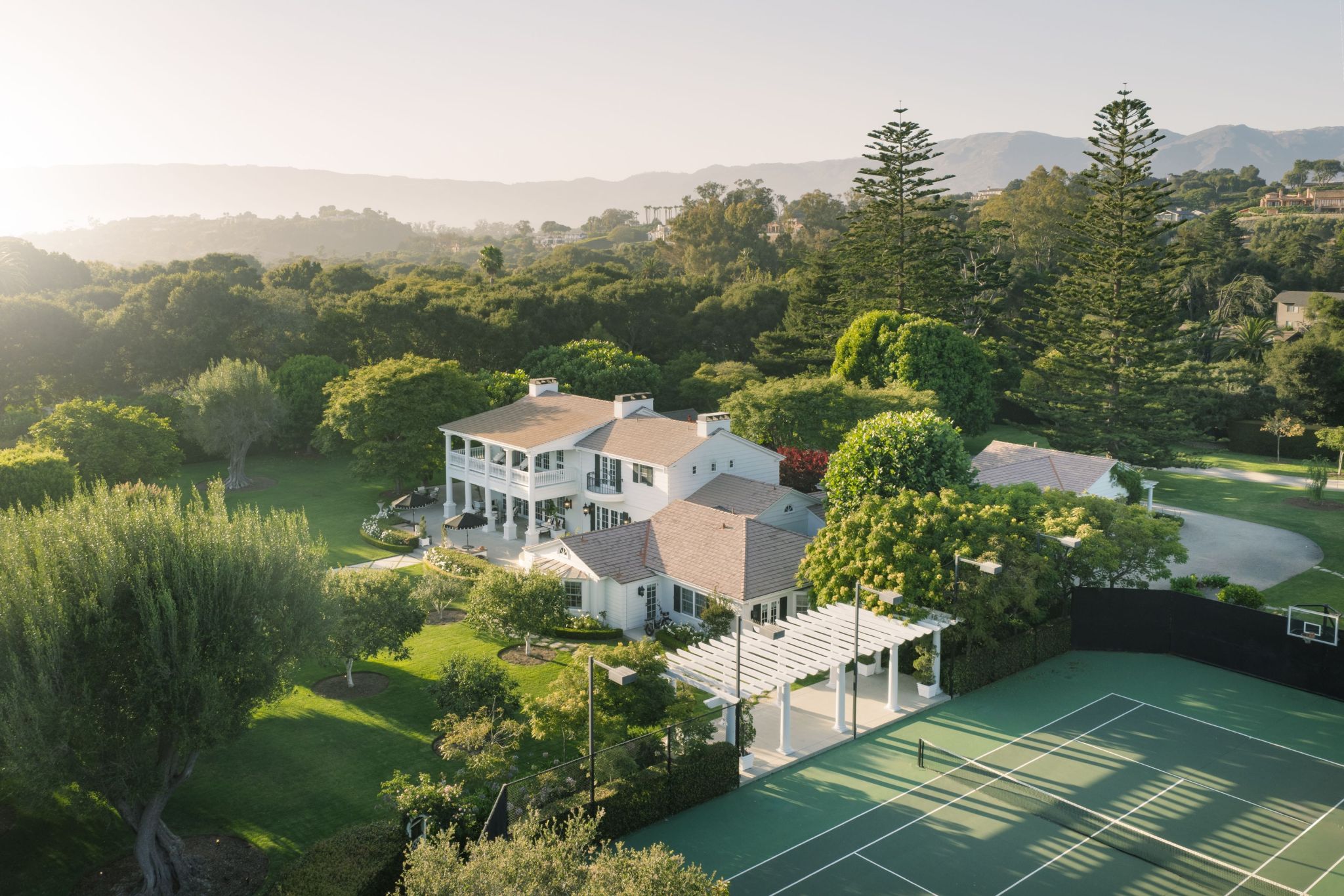 aerial view of Four Oaks estate with tennis courts and home