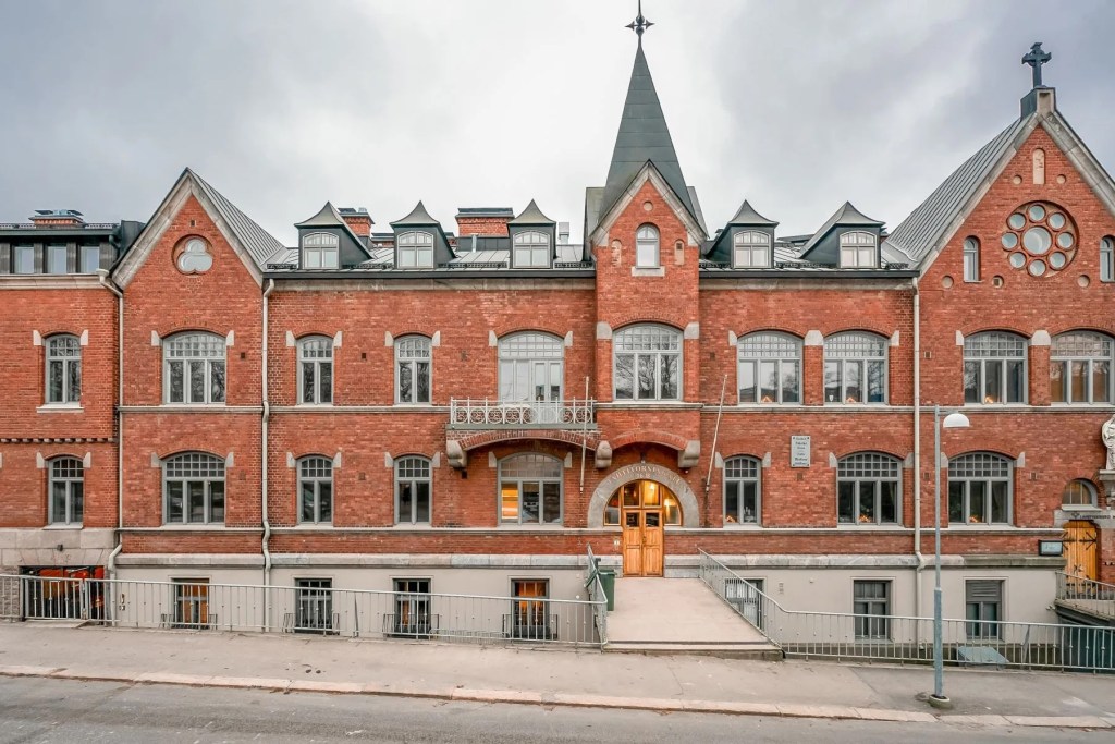 Exterior of red brick art deco-style building in Helsinki, Finland