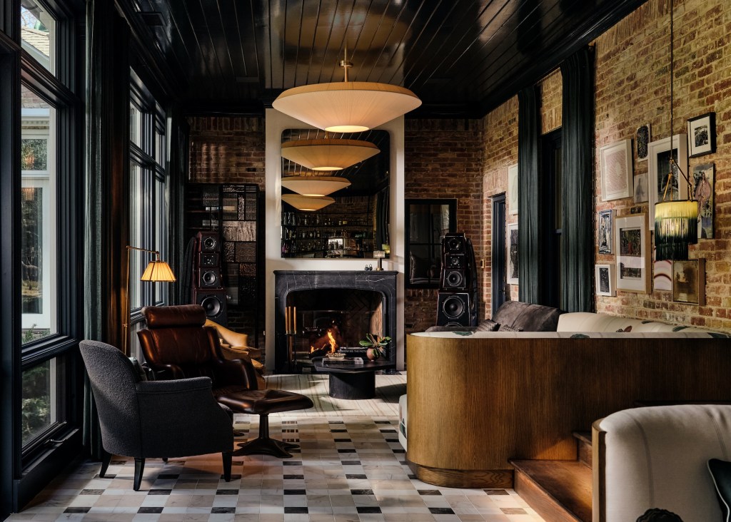 opposite side of Chad Dorsey designed home bar with fireplace and seating