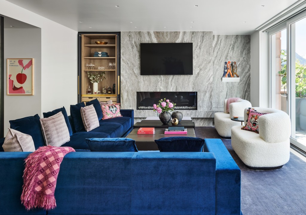 recessed home bar in a living room in Aspen with marble accent wall and fireplace