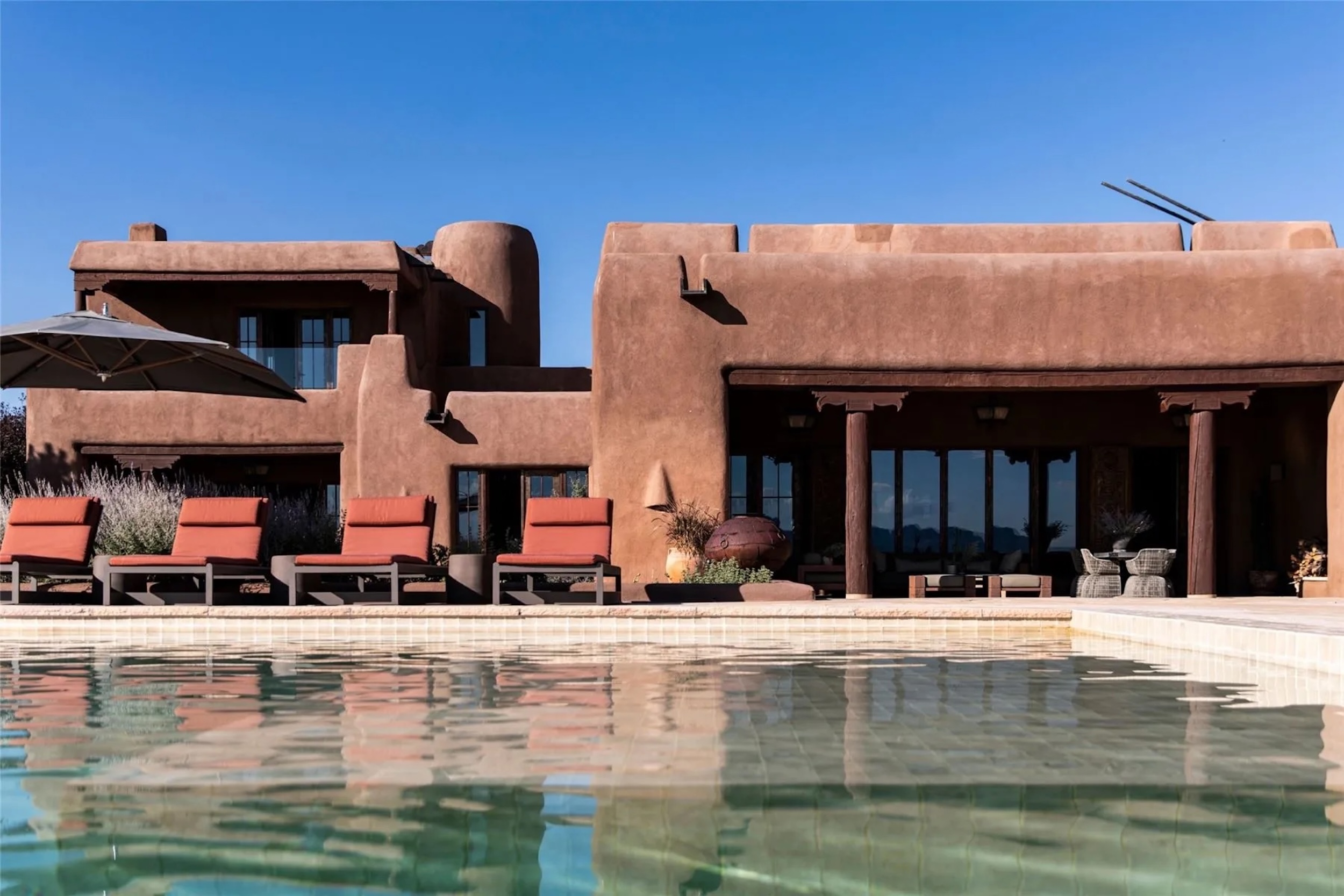 exterior shot of Rancho Alegre estate in Santa Fe, New Mexico featuring the pool deck