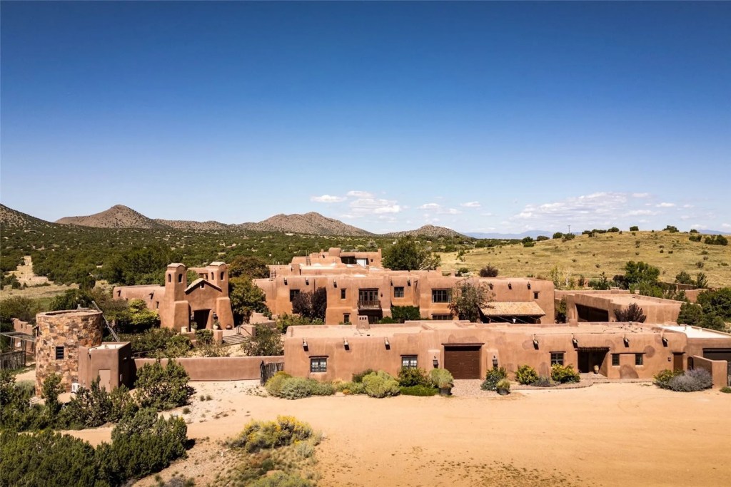 aerial exterior shot of Rancho Alegre estate in Santa Fe, New Mexico with mountains in the background