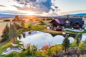 Twilight Moon Ranch aerial view with pond used as a filming location for Yellowstone