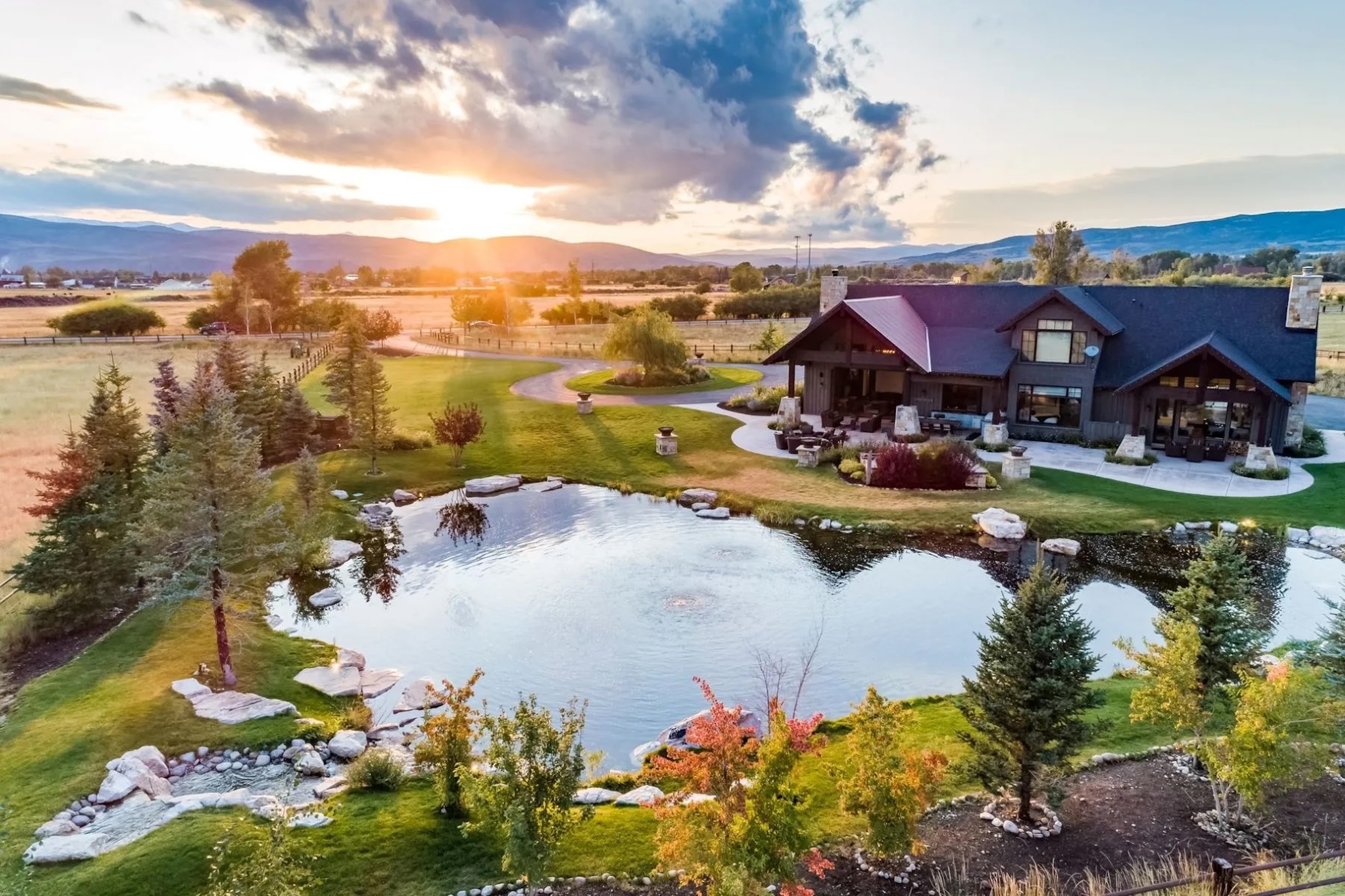 Twilight Moon Ranch aerial view with pond used as a filming location for Yellowstone