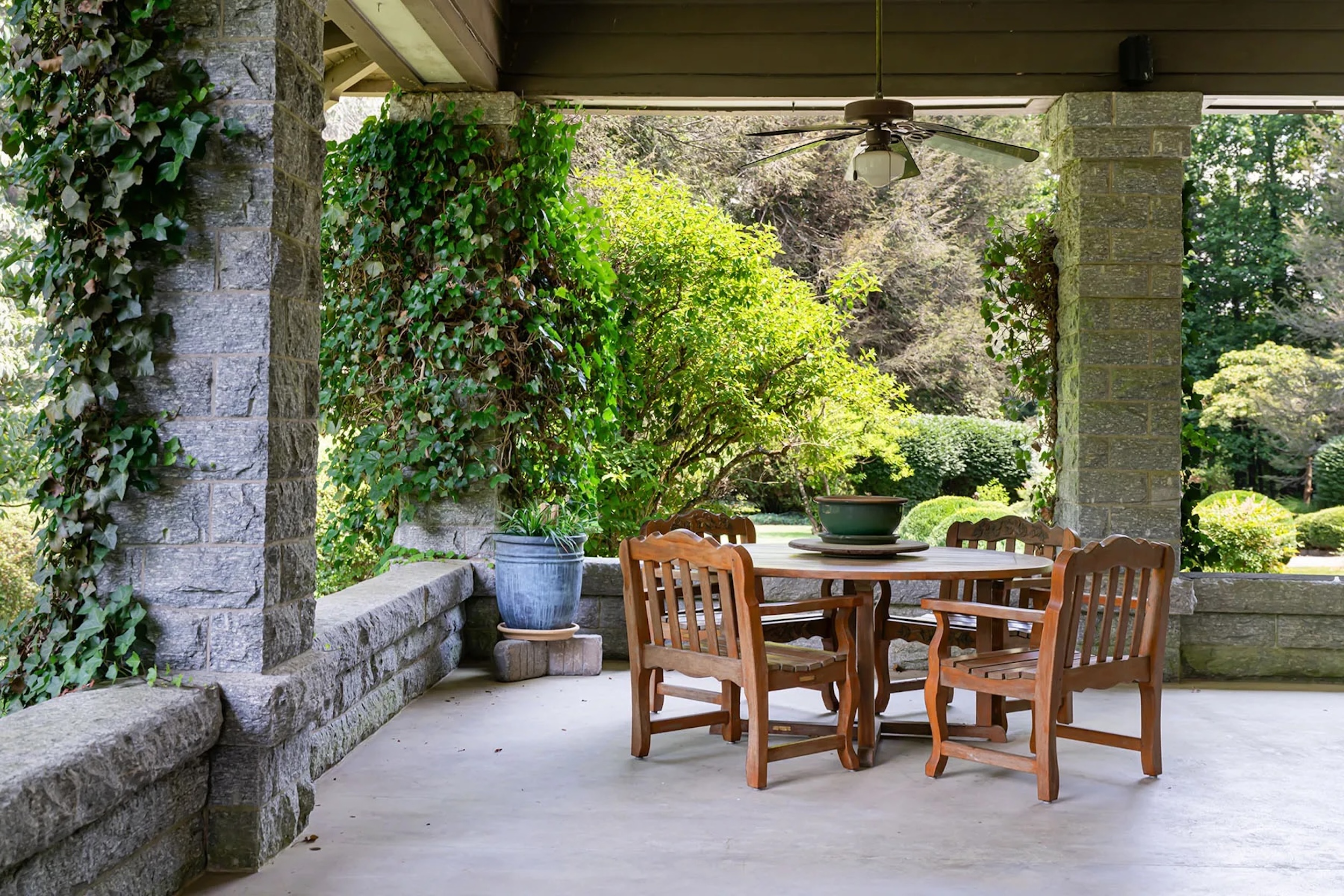 veranda sitting area in North Carolina home surrounded by greenery