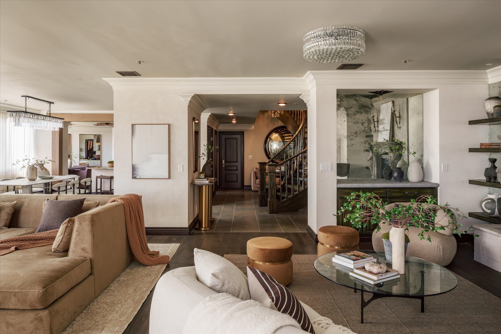sitting room and foyer with grand spiral staircase in Los Angeles penthouse