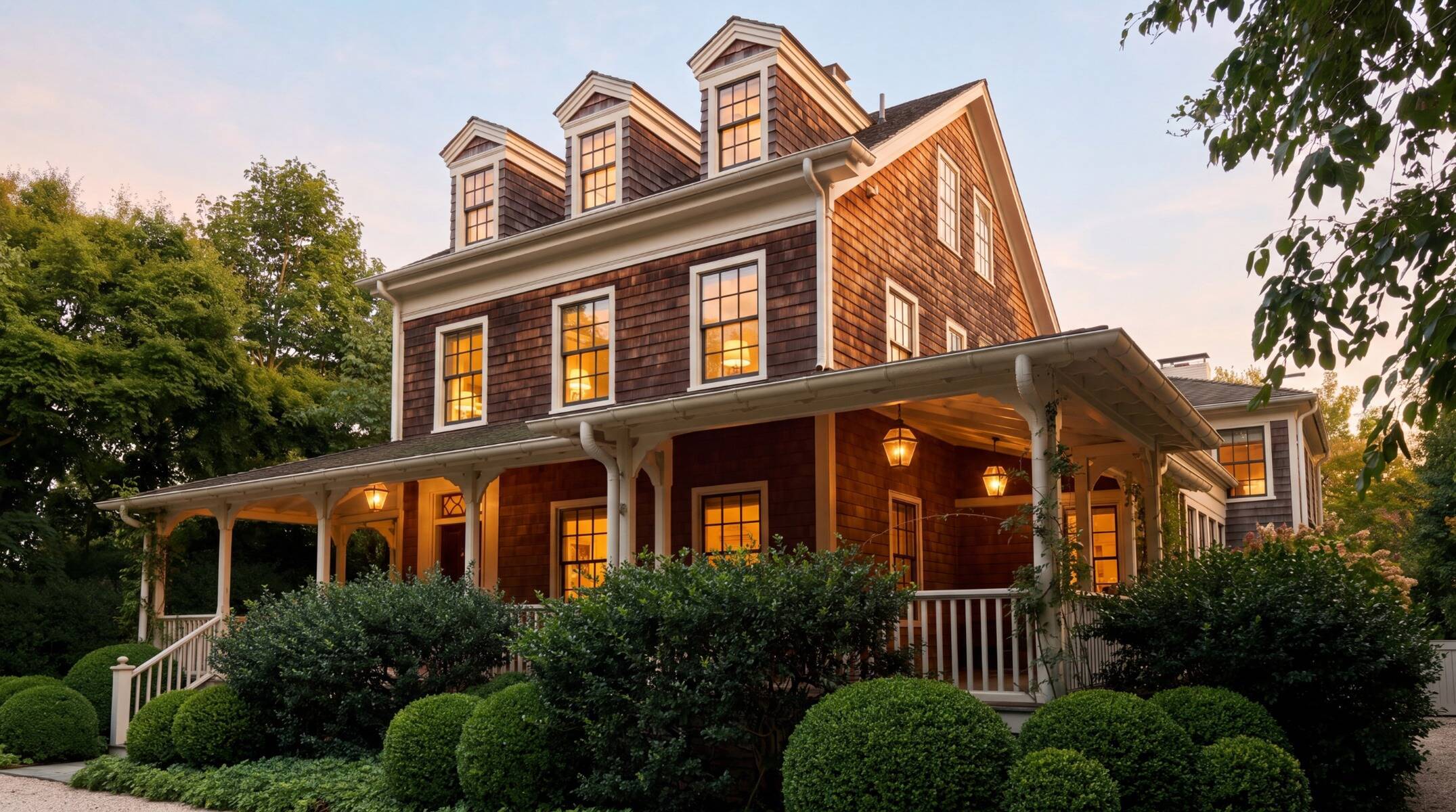 exterior of historic Sag Harbor, NY home with shingle siding and wraparound porches